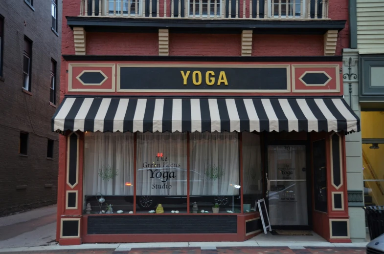 a store front that has yoga items in the window