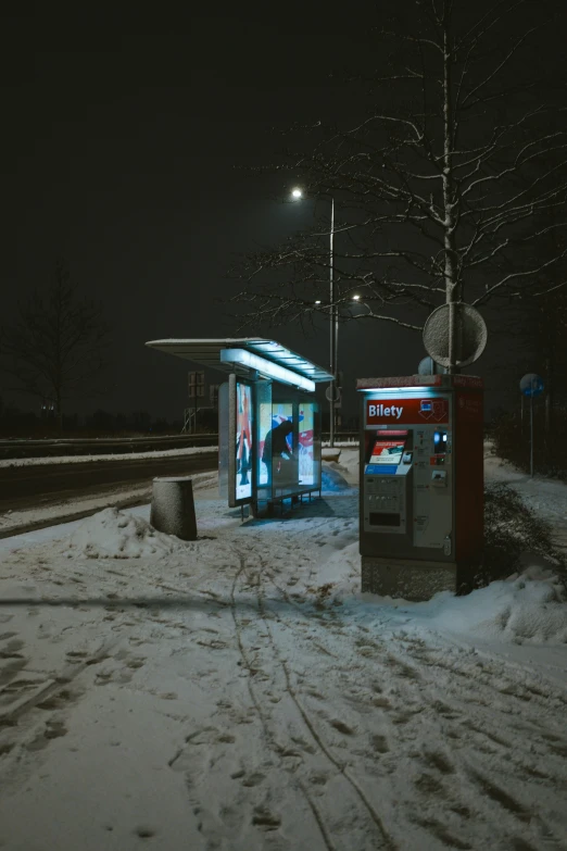 two small kiosks are left out on the snow