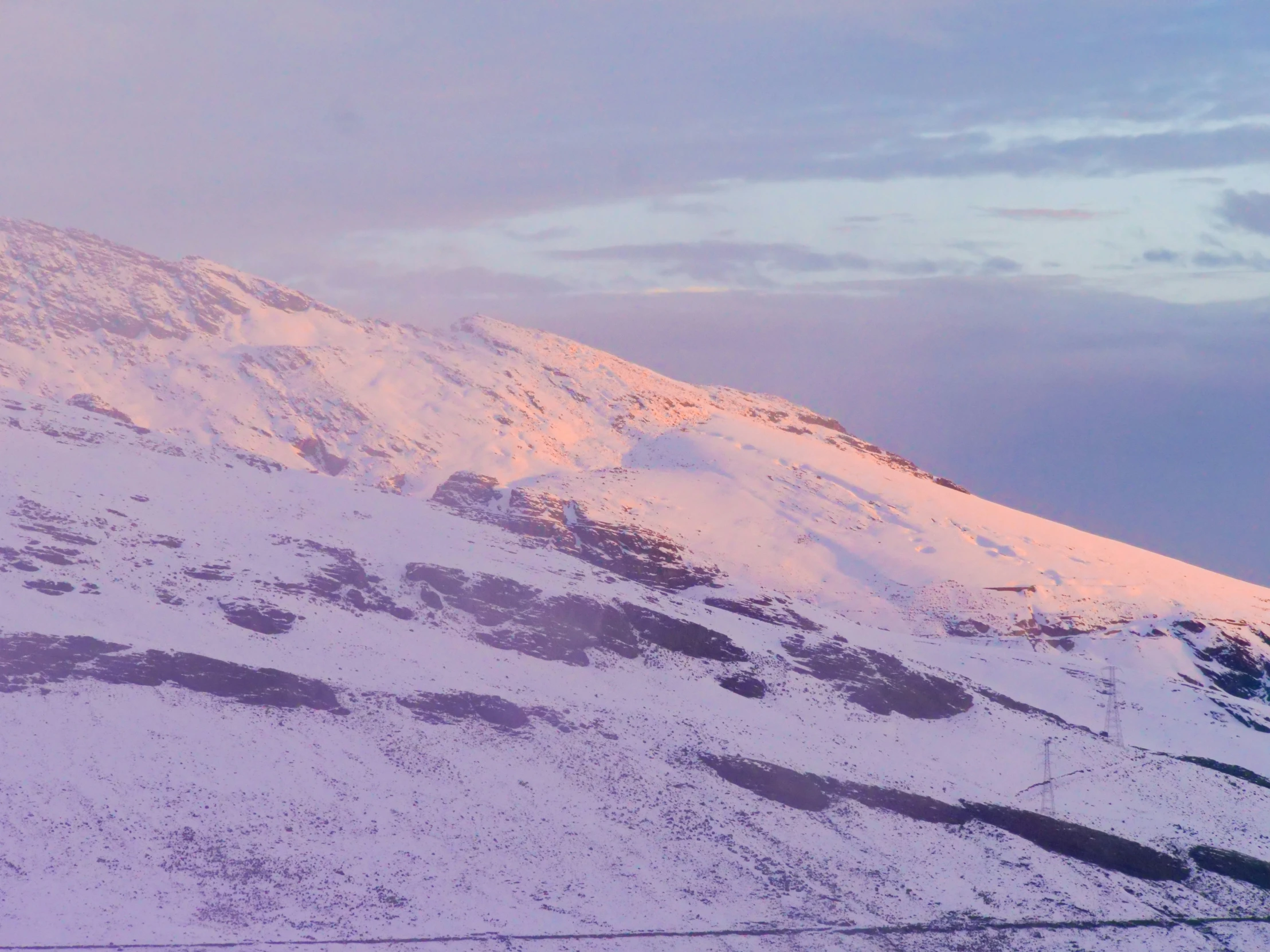 a person skiing in the snow on a mountain