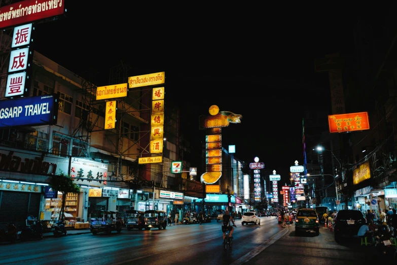 a busy city street with people walking and riding bicycles