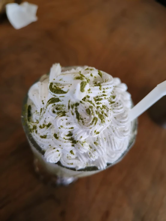 a glass with some kind of whipped cream in it