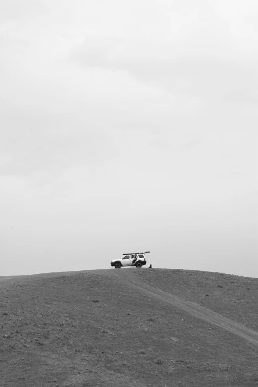 a truck driving on top of a big field