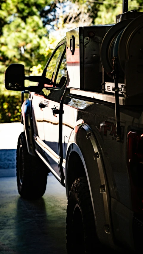 a big truck with some storage bins on it's back