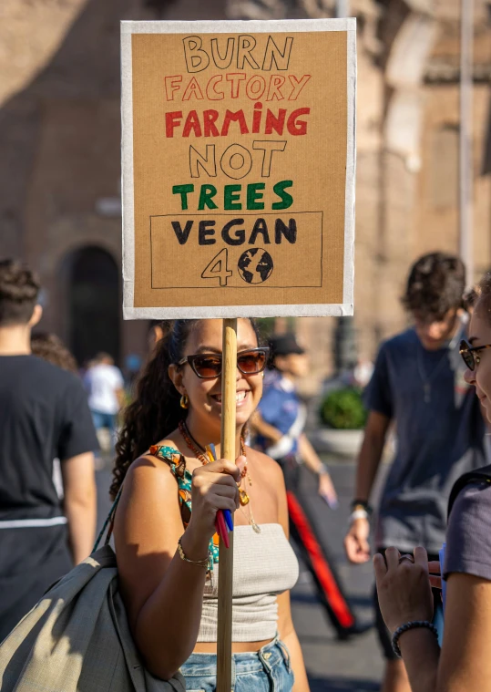 women in a group holding signs at a demonstration