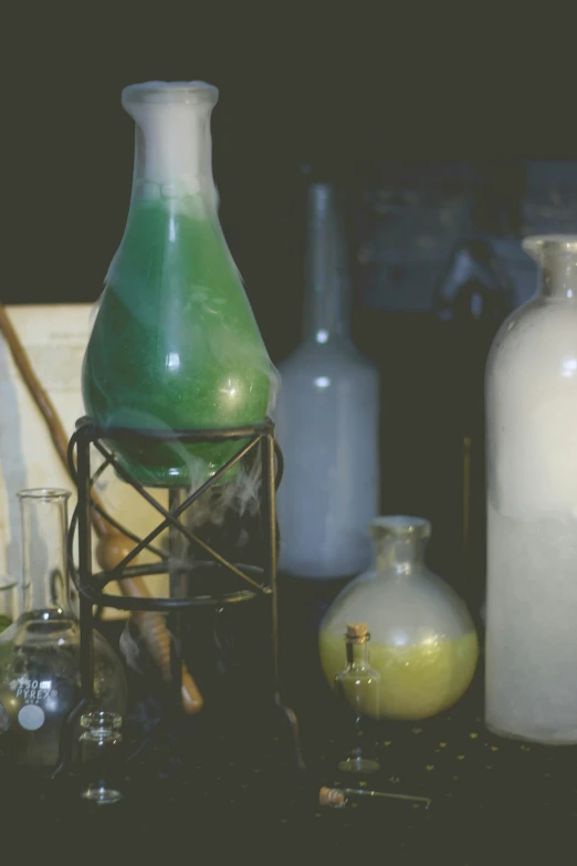 bottles are displayed with beakers and other items