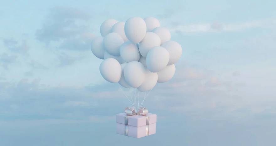 a gift wrapped in a paper box is floating from balloons