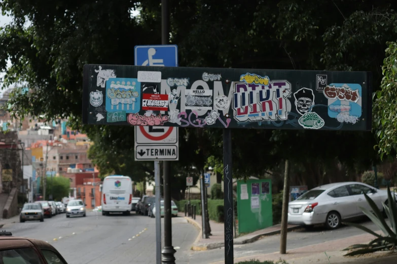 a bunch of street signs sitting on top of a pole