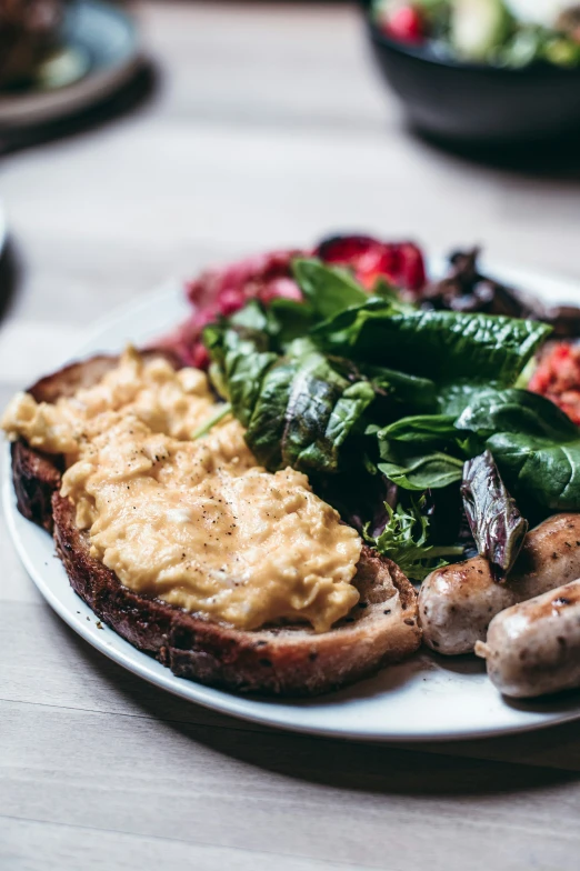 a plate filled with meat and vegetables on top of a table