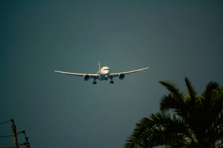 the jet airplane was flying low over the roof