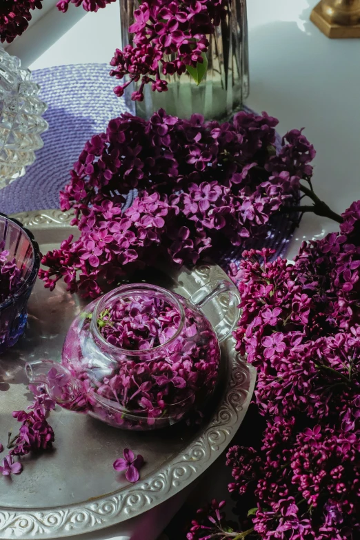 a tray of flowers and some water