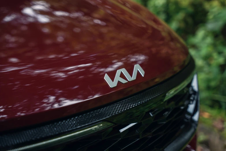 a close up of the front grill on a red car