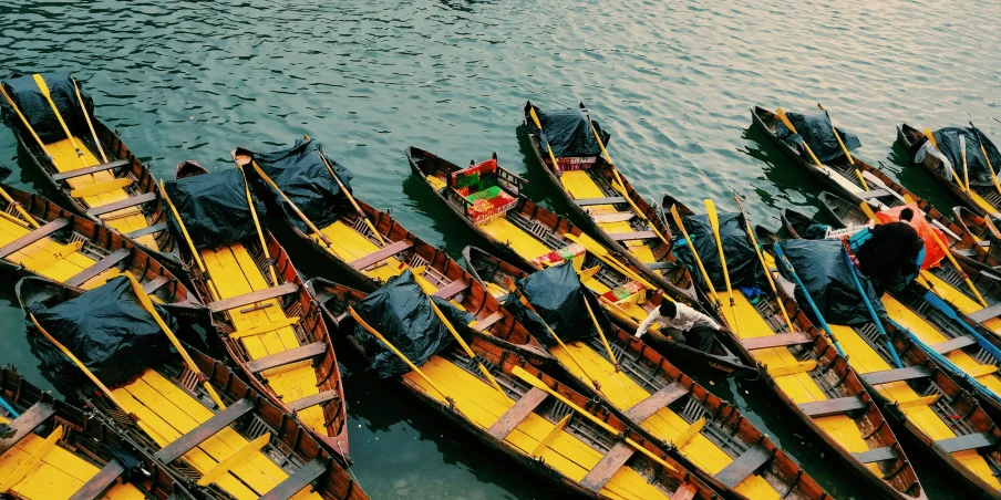 the canoes are in a lot on the water