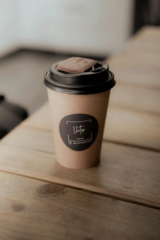 an empty coffee cup is on the wooden table