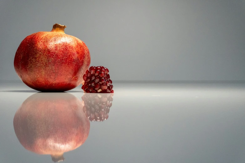 a pomegranate on the side and a single pomegranate