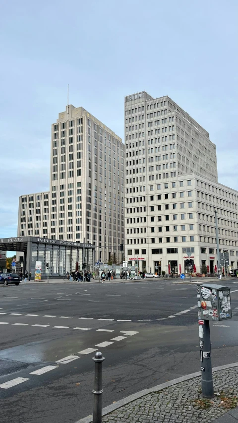 two large buildings sit across from a traffic light