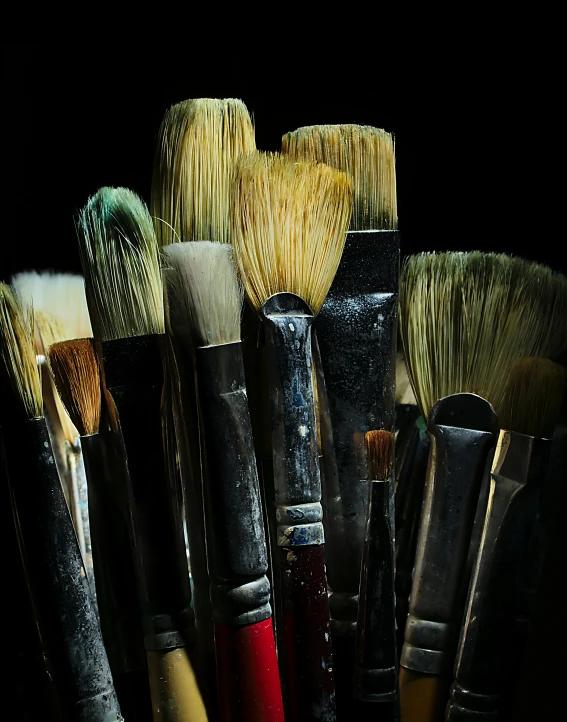 brushes on a table in the dark