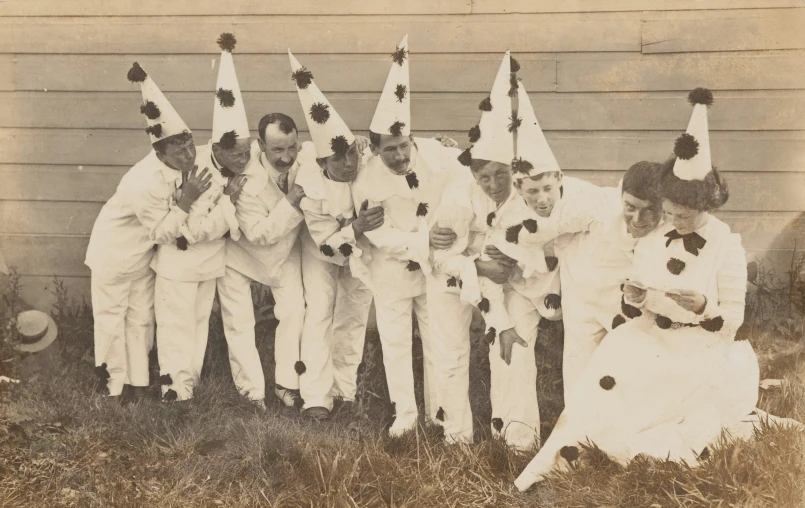 seven dressed up people in costume posing together