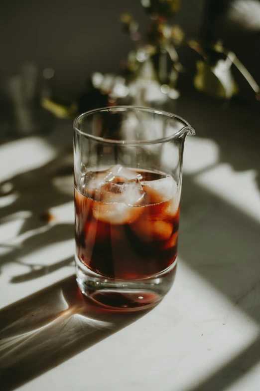 an icy beverage being poured in a clear glass