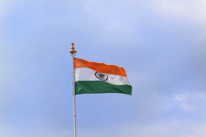 the indian flag is flying high in the air