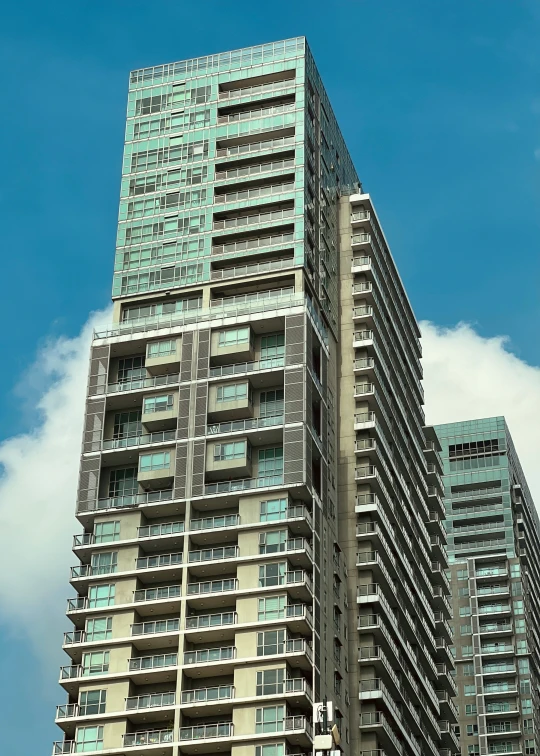 a very tall building with glass windows on the front