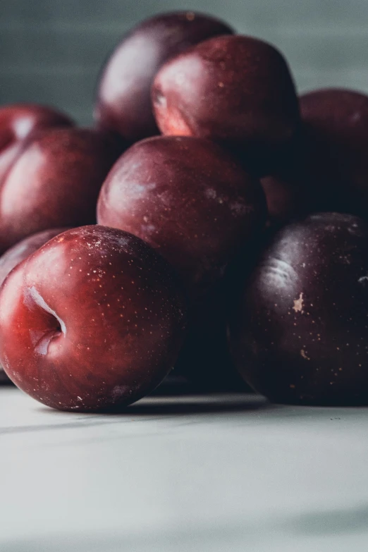 the fruit is red and green with a black spot