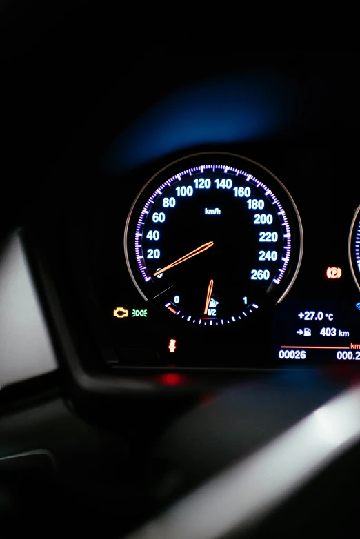 the dashboard of a car in the dark