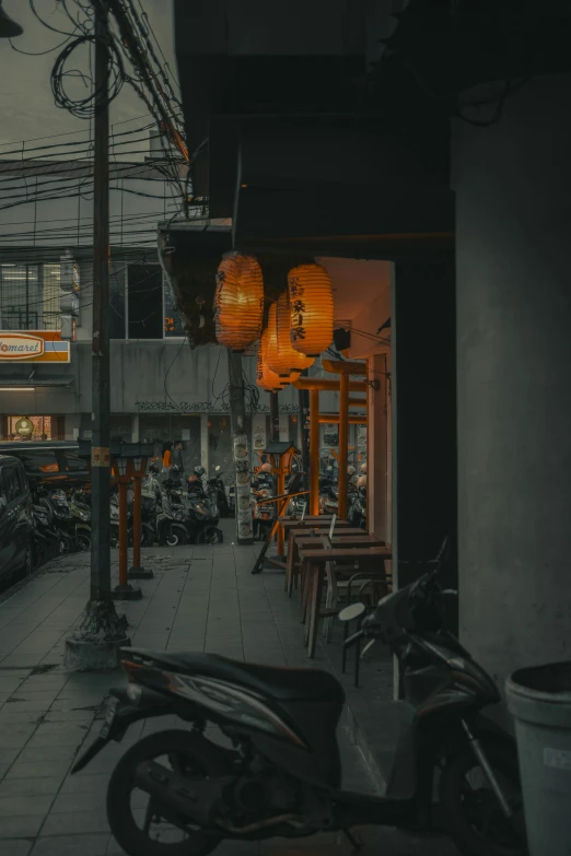 motorcycles parked in front of an outdoor cafe