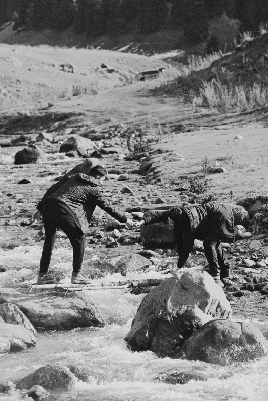 a couple of men who are in some water