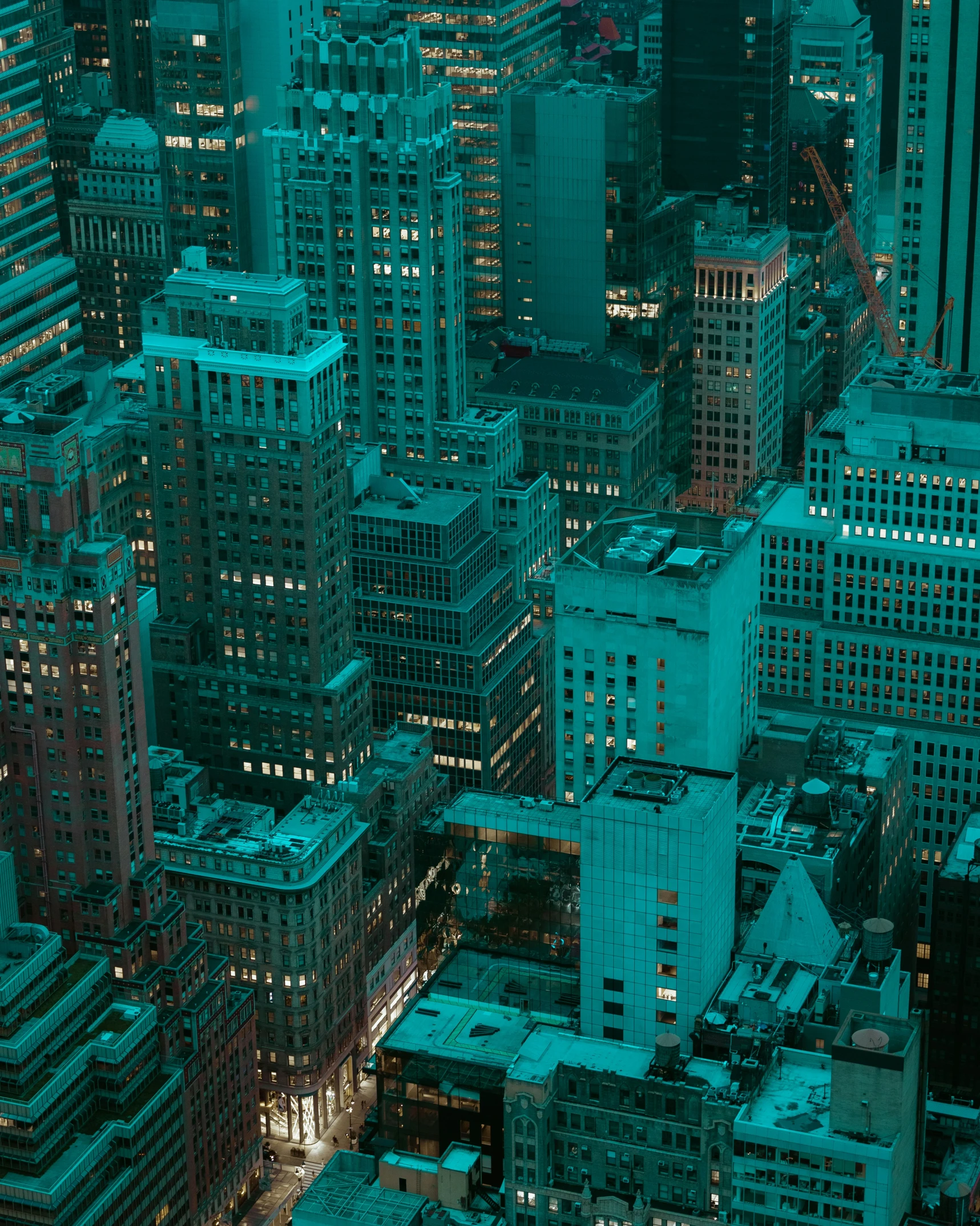 large city buildings in a big city lit up at night