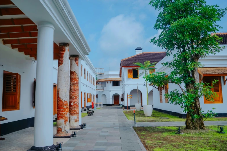 an outside walkway between two buildings