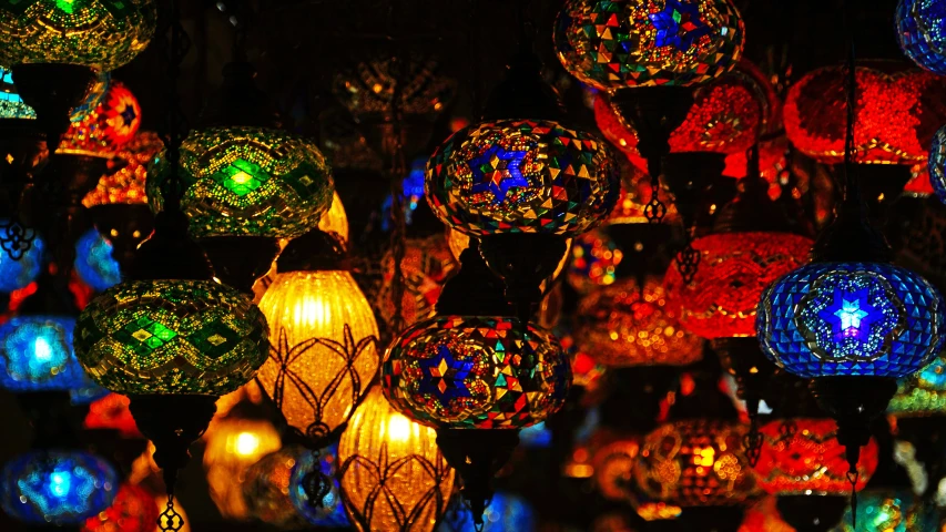 a display of lit up lights hanging in the dark