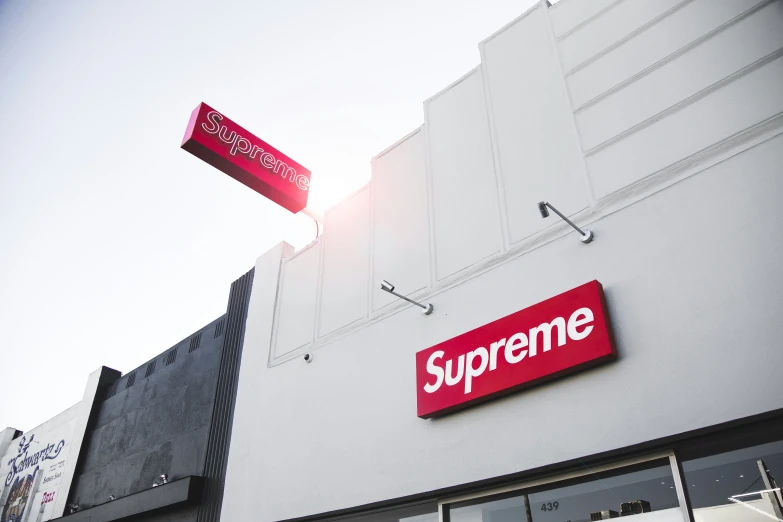 a big, white building has a sign that says supreme on it