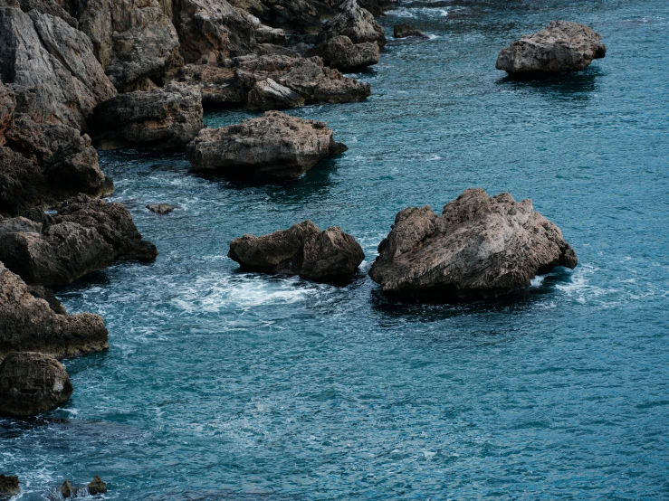 a large body of water surrounded by rocks