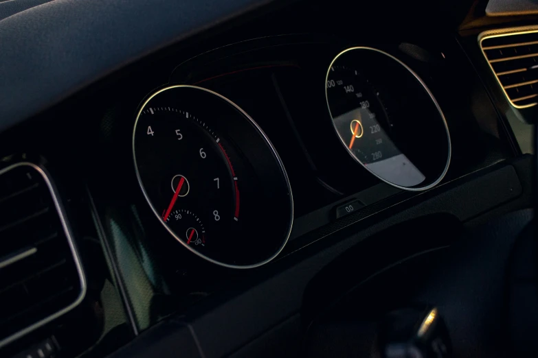 the dashboard and dash of a car with a yellow line on it