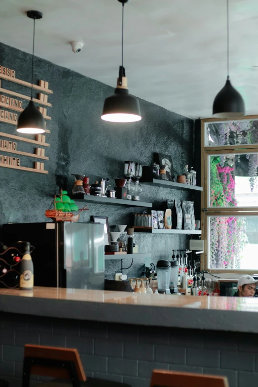 a bar in a store with multiple hanging lights