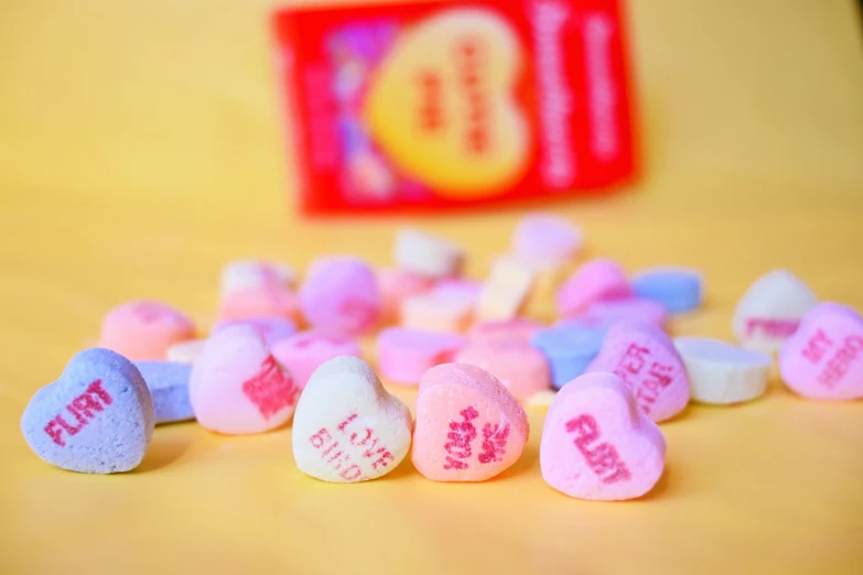 candy hearts shaped as candys with different phrases on them