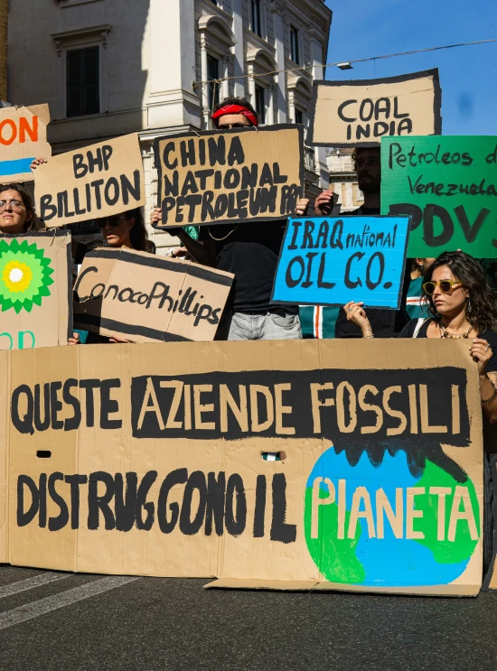 several protest signs placed on the street for the climate change campaign