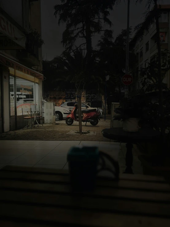 a dark parking lot with parked cars parked in it