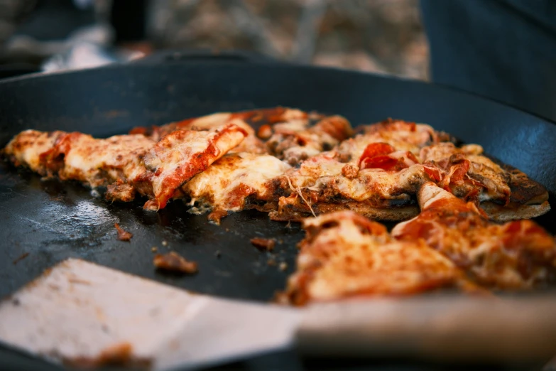 slice of pizza on set being cooked