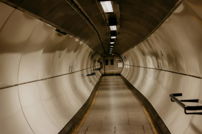 a bench inside a tunnel on the side of the road