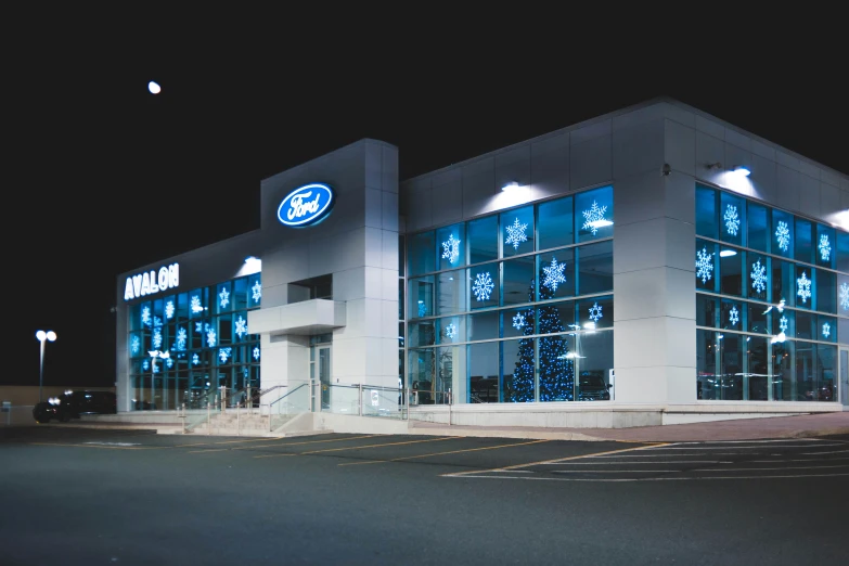 a store front at night with its lights on