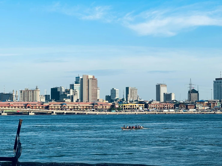 an urban skyline over looking a harbor on the edge of a large city