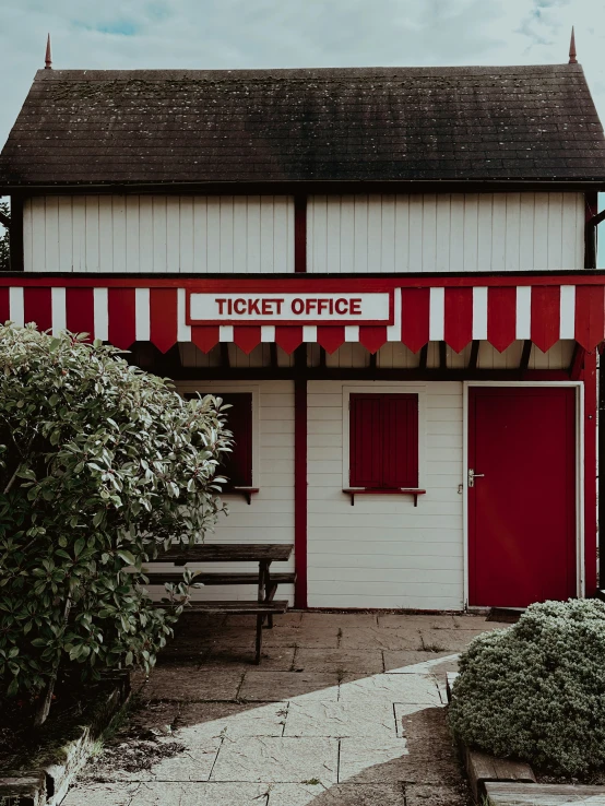 the ticket office is painted white and red