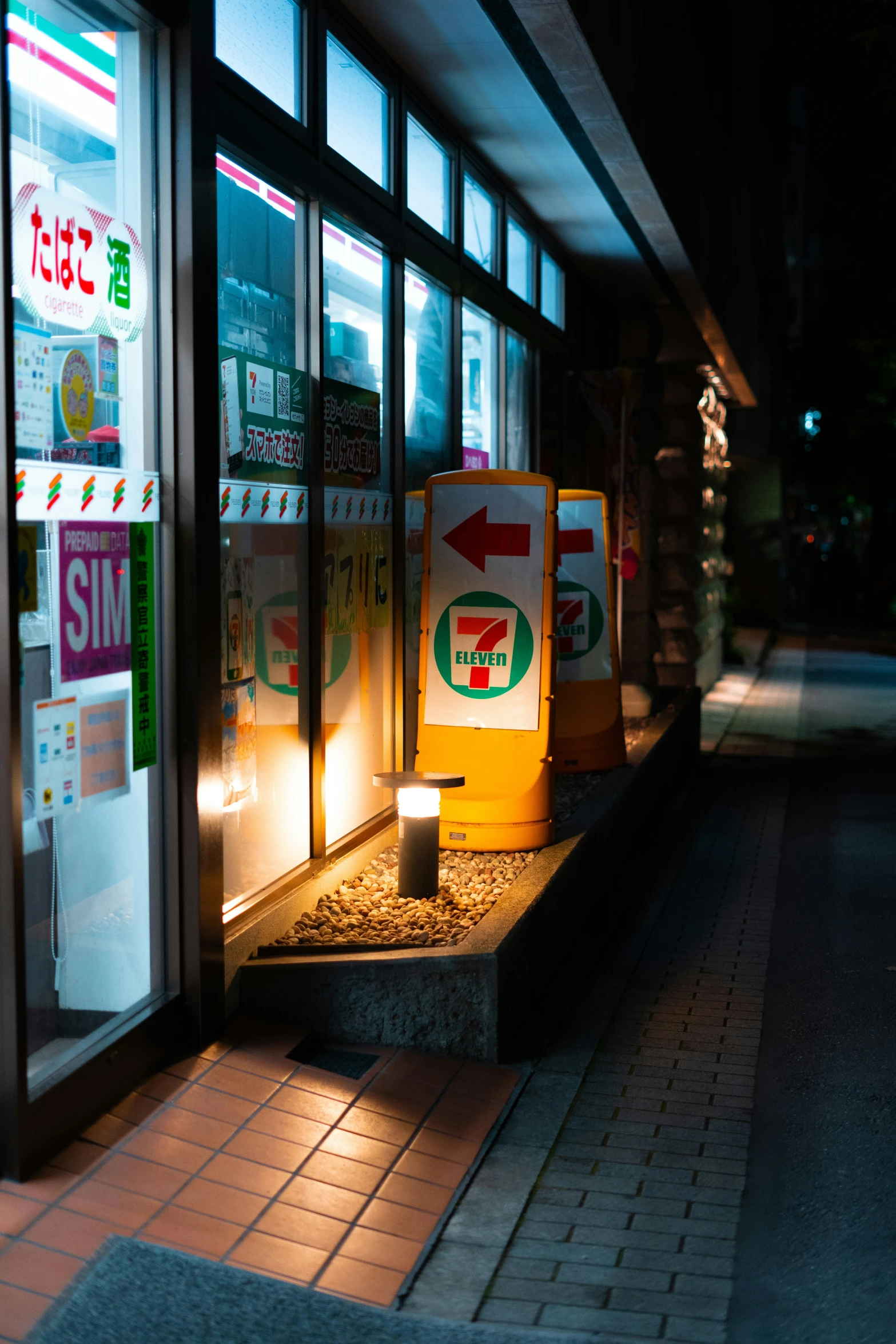 the light on the food store window is shining brightly