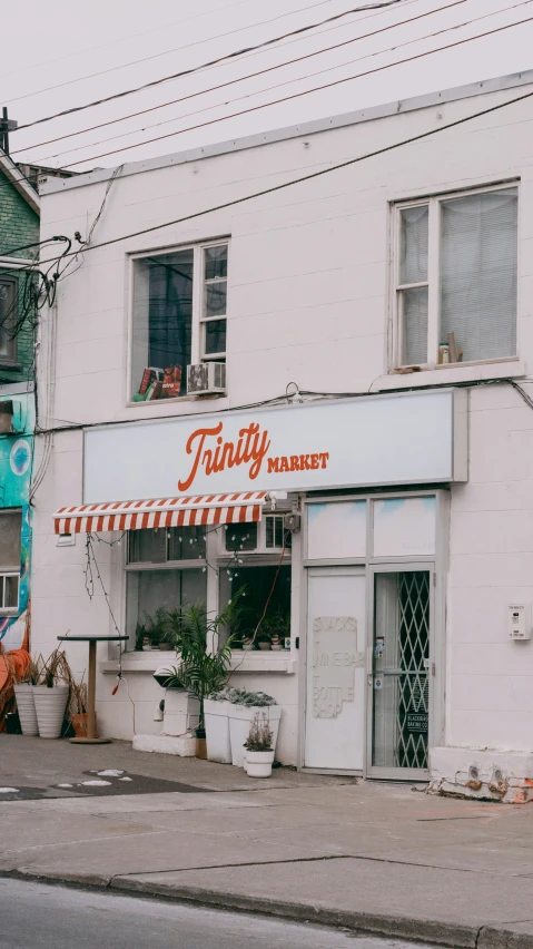 a white building with an orange sign that reads findley street