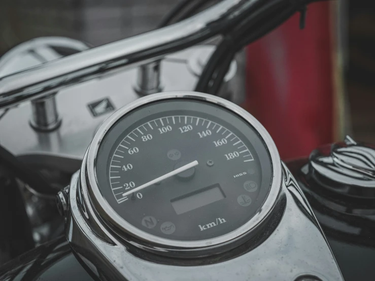 a motorcycle dashboard is shown with the time displayed