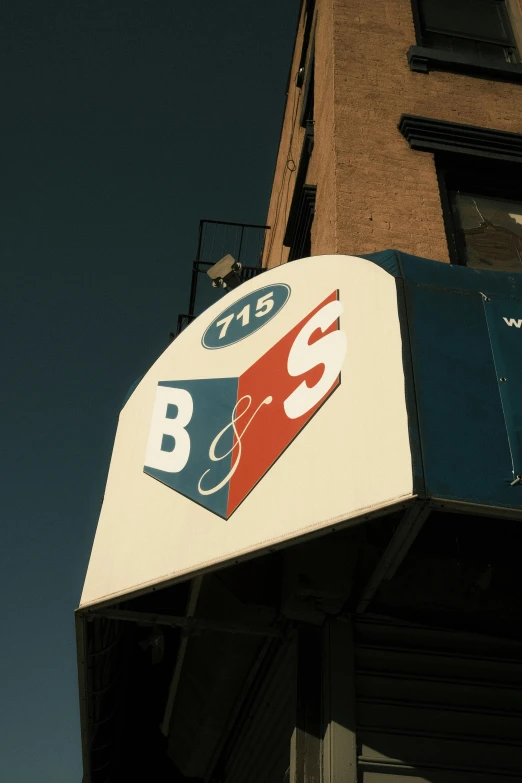 close up of a b & b sign with a sky background