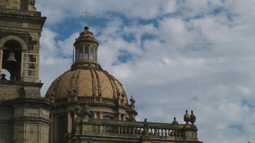 a large building with a dome with a flag on top