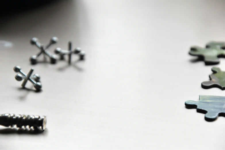 a pile of shiny silver metal items laying next to each other