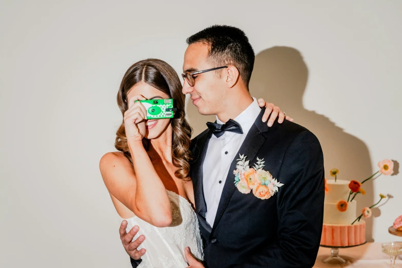 a man and woman wearing wedding glasses